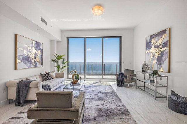 tiled living room with a water view