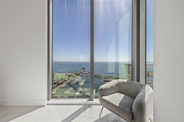 sitting room featuring a water view