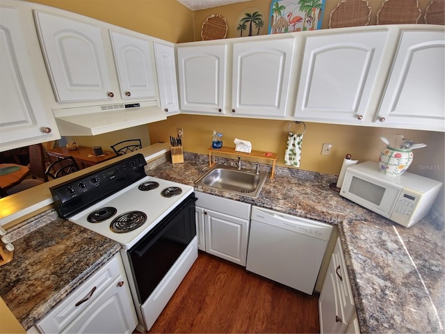 kitchen with white appliances, white cabinetry, and dark wood-type flooring