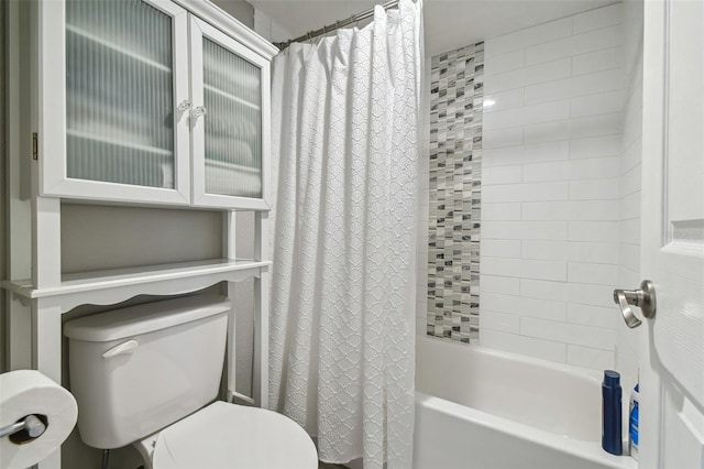 bathroom with toilet and shower / tub combo