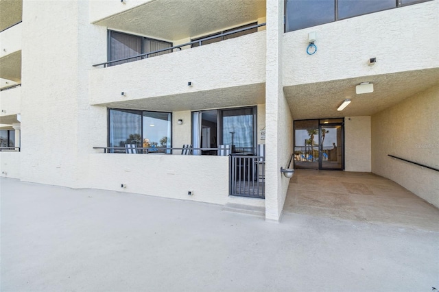 entrance to property featuring a balcony