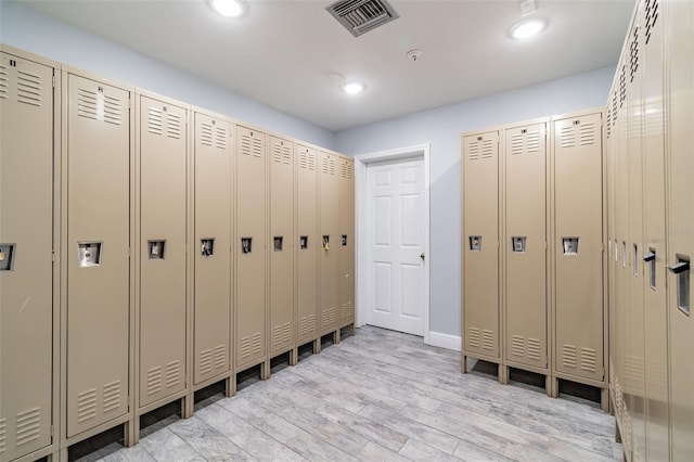 mudroom with light hardwood / wood-style floors