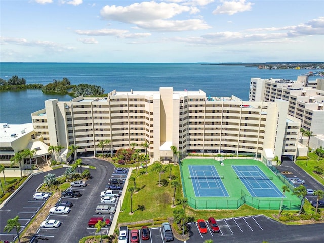 birds eye view of property with a water view