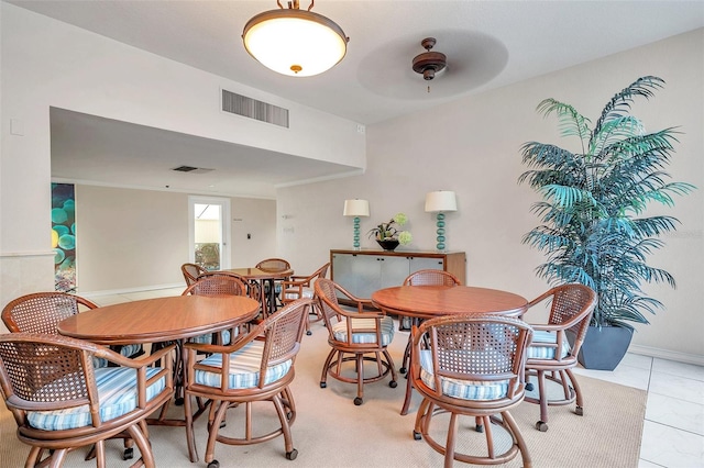 dining room featuring ceiling fan and light tile flooring