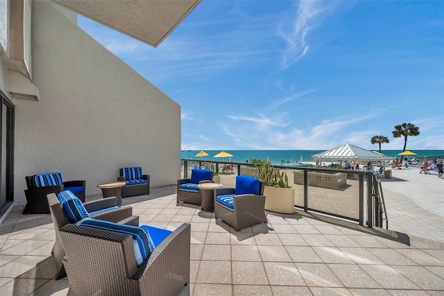 view of patio with a water view and an outdoor hangout area