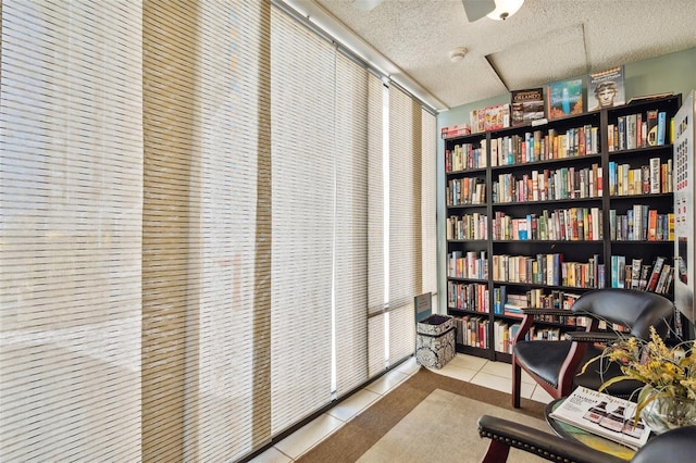 tiled office featuring a textured ceiling