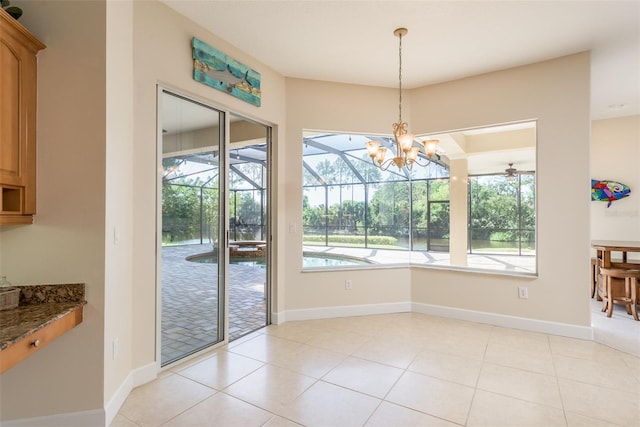 tiled dining room featuring a notable chandelier