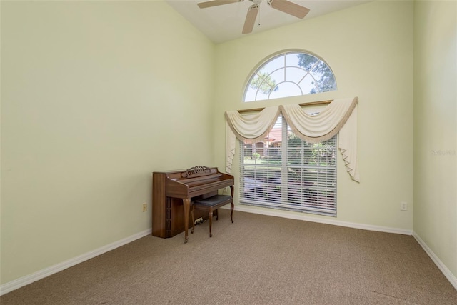 unfurnished room featuring vaulted ceiling, ceiling fan, and carpet floors