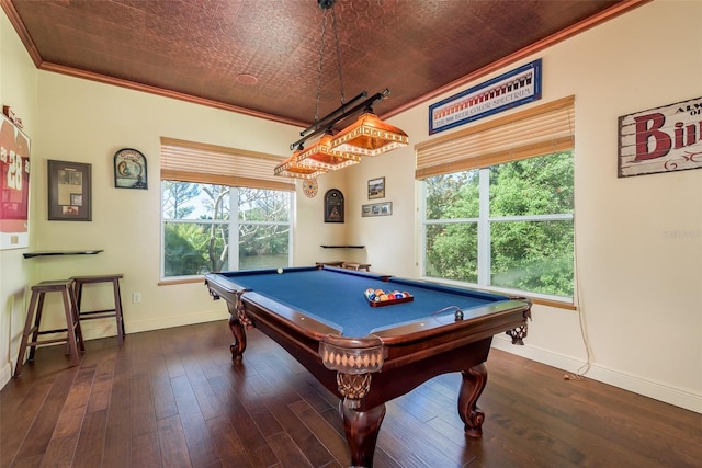 rec room featuring dark hardwood / wood-style flooring, crown molding, a wealth of natural light, and billiards