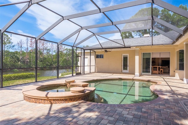 view of pool featuring a patio, a lanai, and a water view