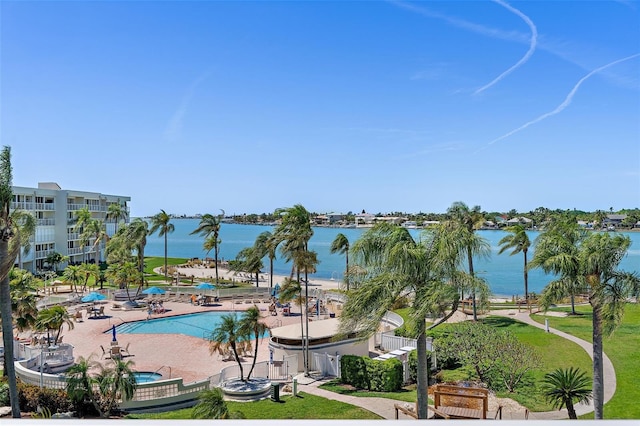 view of swimming pool with a water view