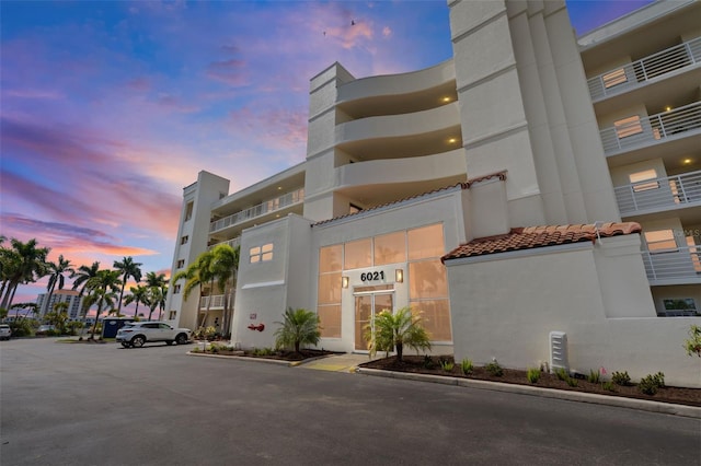 view of outdoor building at dusk