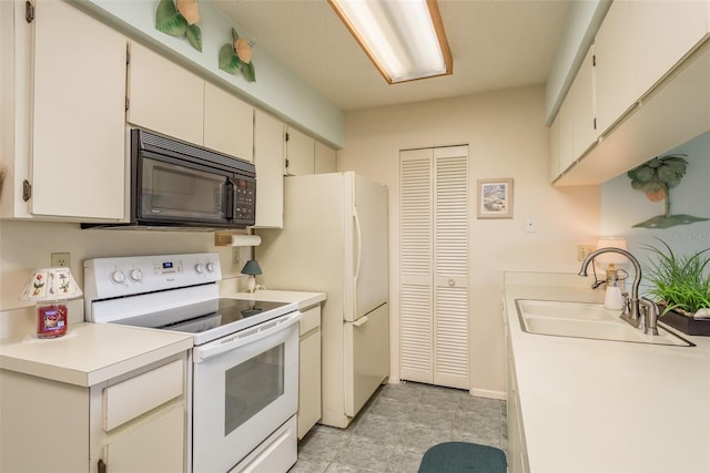 kitchen with white cabinetry, light tile floors, sink, and white electric range oven