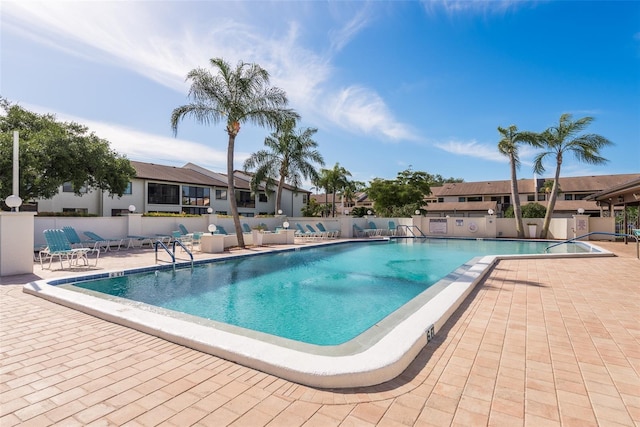 view of swimming pool with a patio