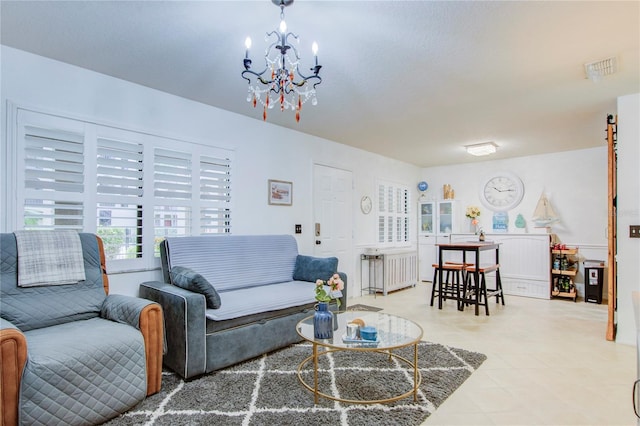 living room with an inviting chandelier, radiator, and light tile floors