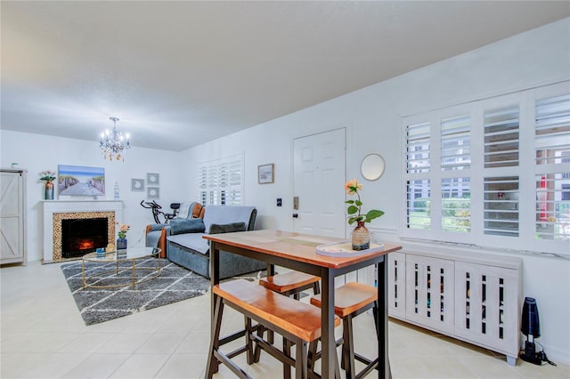 tiled dining space with a chandelier and radiator heating unit