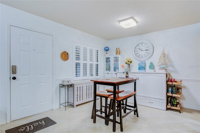 dining area with light tile flooring