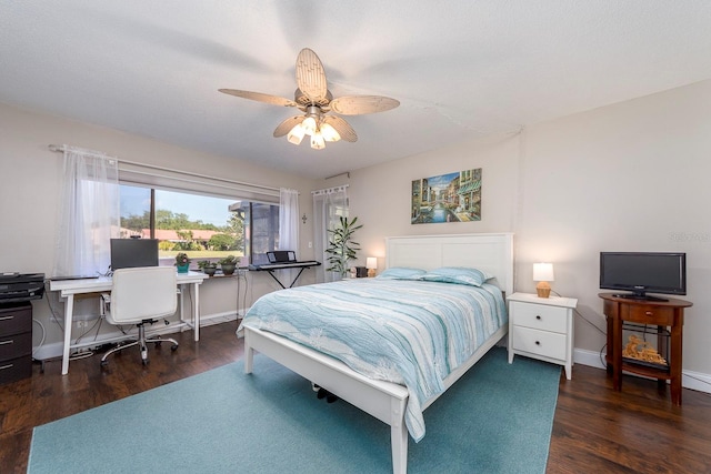 bedroom featuring dark hardwood / wood-style floors and ceiling fan