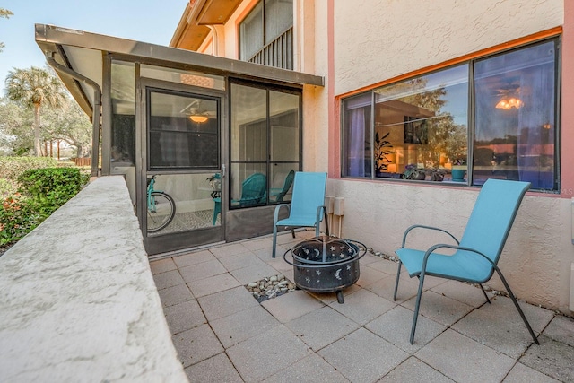 view of patio / terrace featuring an outdoor fire pit