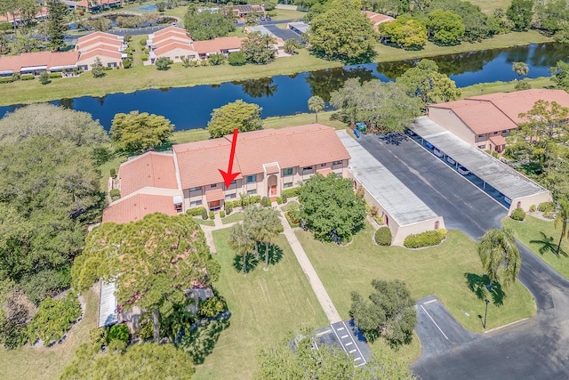 birds eye view of property with a water view