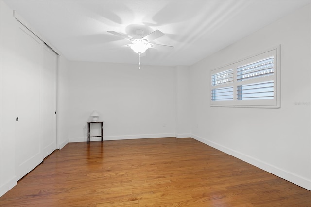 empty room featuring ceiling fan and light hardwood / wood-style floors