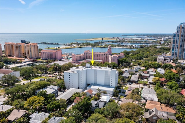 birds eye view of property with a water view