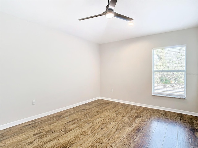 empty room with wood-type flooring and ceiling fan