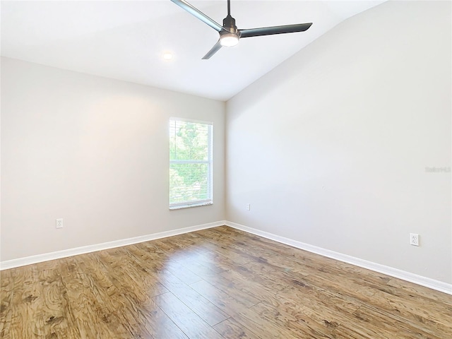 unfurnished room with lofted ceiling, ceiling fan, and light hardwood / wood-style floors