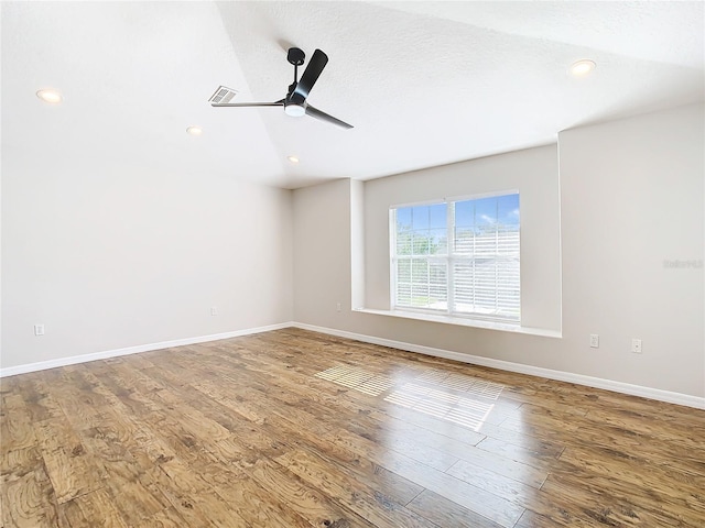 unfurnished room with ceiling fan and hardwood / wood-style floors