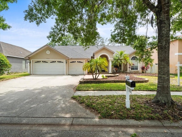 ranch-style home with a garage