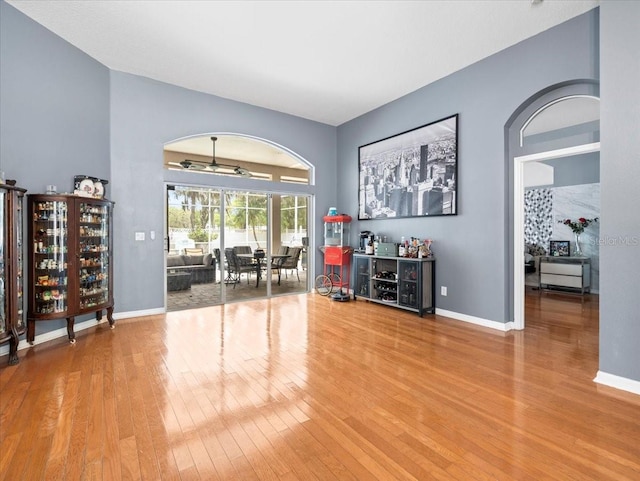 unfurnished room with light hardwood / wood-style floors and ceiling fan