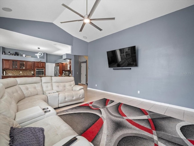 tiled living room featuring lofted ceiling and ceiling fan