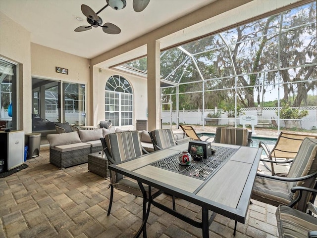 sunroom / solarium with ceiling fan