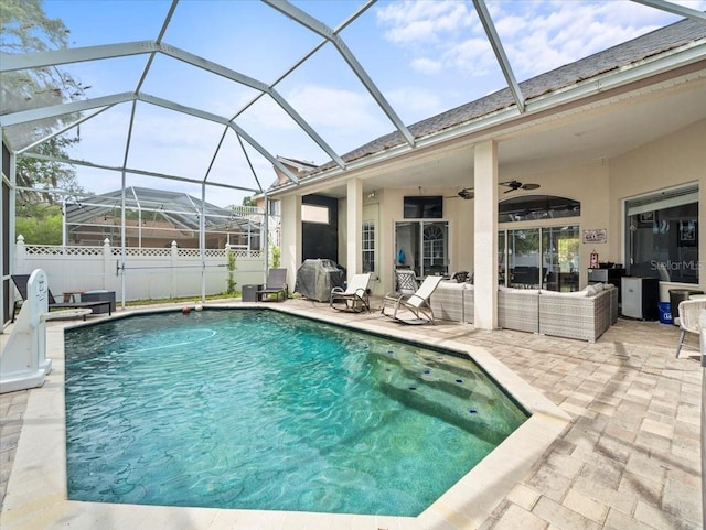 view of pool featuring a grill, ceiling fan, a lanai, a patio, and an outdoor living space