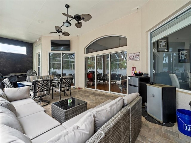 view of patio with ceiling fan and outdoor lounge area