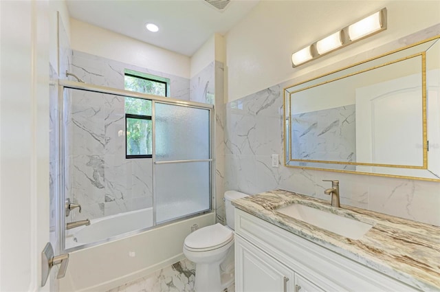 full bathroom with vanity, toilet, and enclosed tub / shower combo