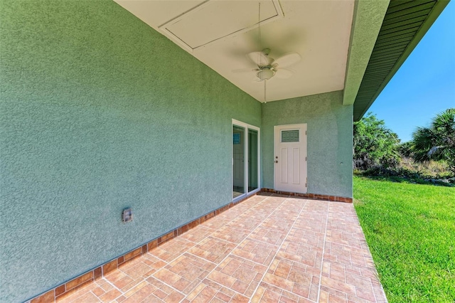 view of patio featuring ceiling fan