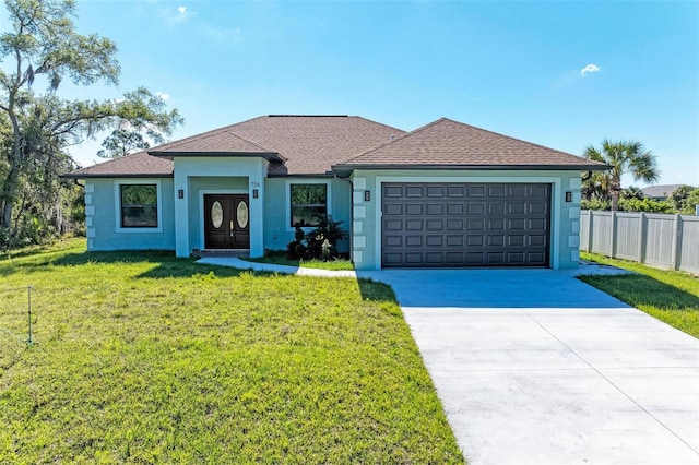 view of front facade featuring a garage and a front lawn