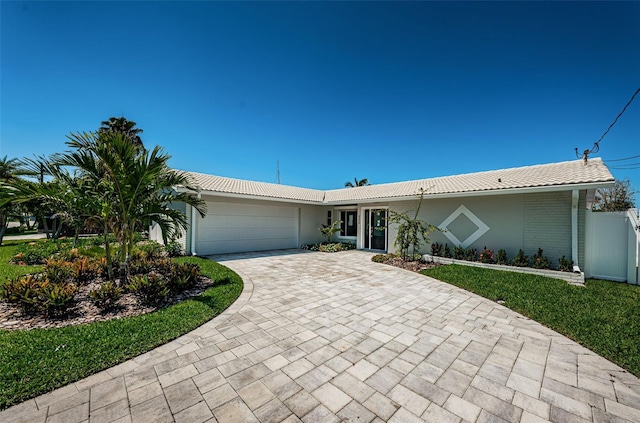 single story home with a garage