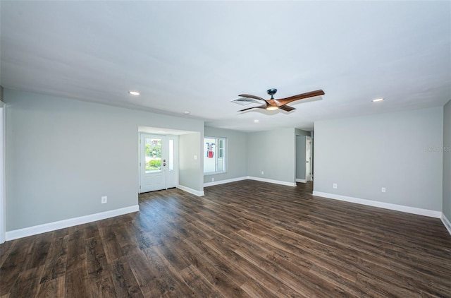 spare room with dark hardwood / wood-style floors and ceiling fan