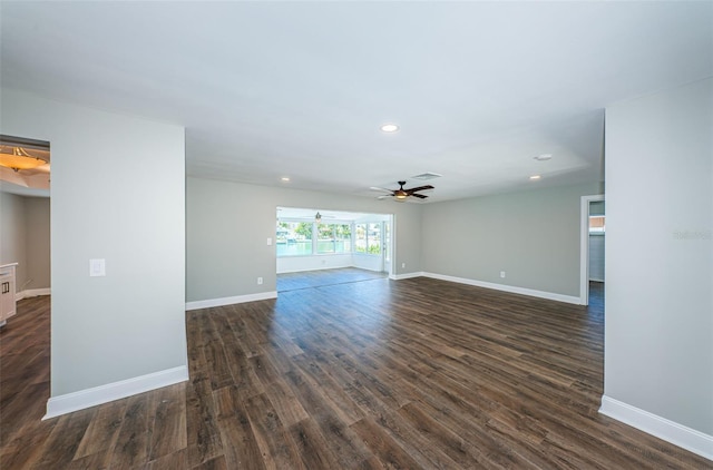 empty room with dark hardwood / wood-style floors and ceiling fan