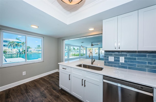 kitchen featuring ceiling fan, sink, stainless steel dishwasher, decorative backsplash, and white cabinets