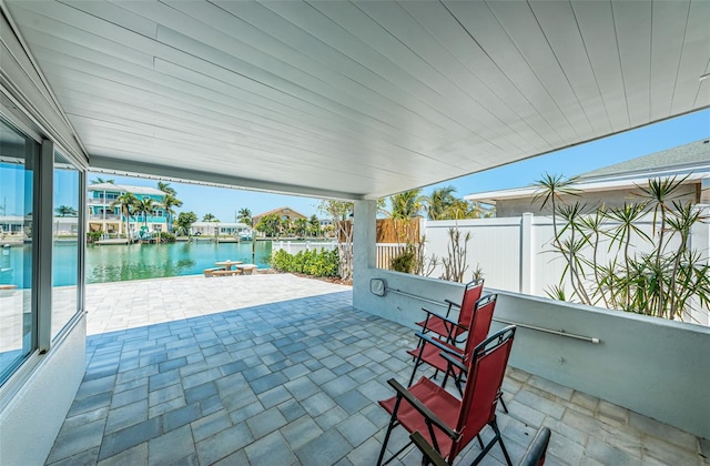 view of patio featuring a water view