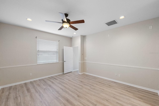 unfurnished room with ceiling fan and light wood-type flooring