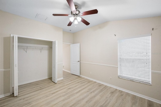 unfurnished bedroom featuring ceiling fan, a closet, and light hardwood / wood-style flooring