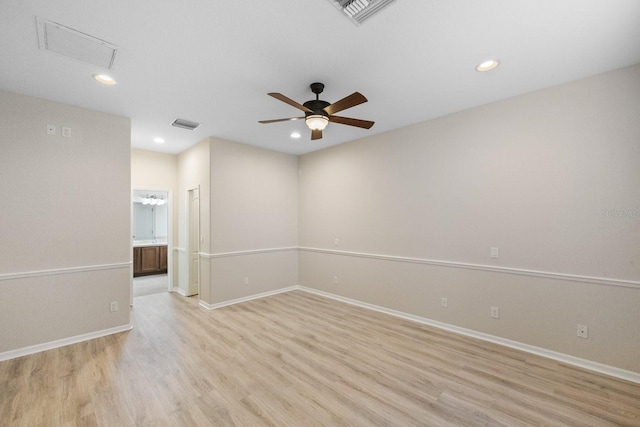 unfurnished room featuring ceiling fan and light wood-type flooring