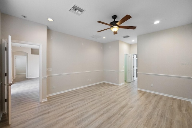 unfurnished room featuring ceiling fan and light wood-type flooring