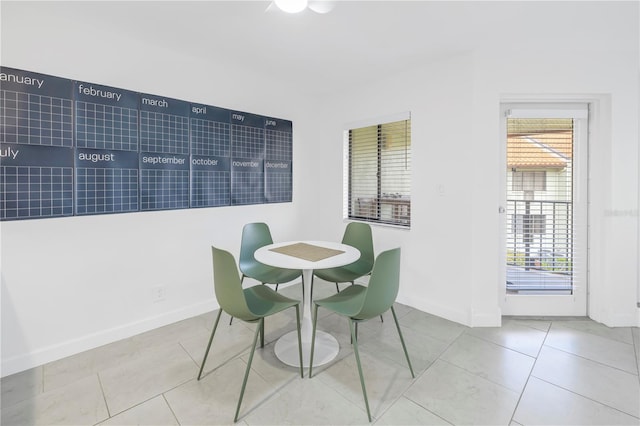 dining room with light tile floors