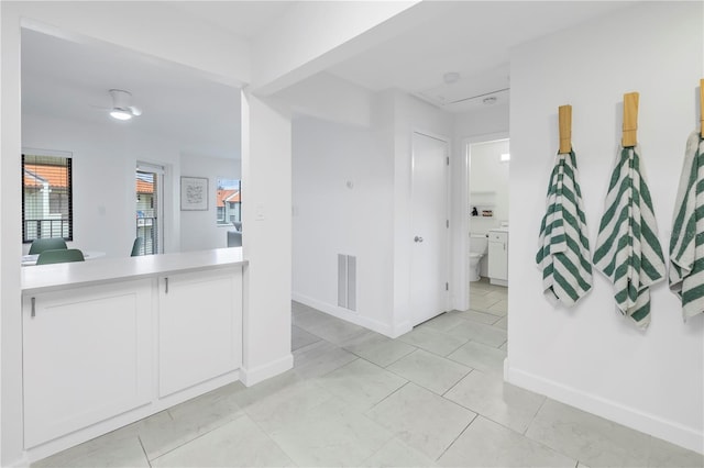 hallway with light tile floors