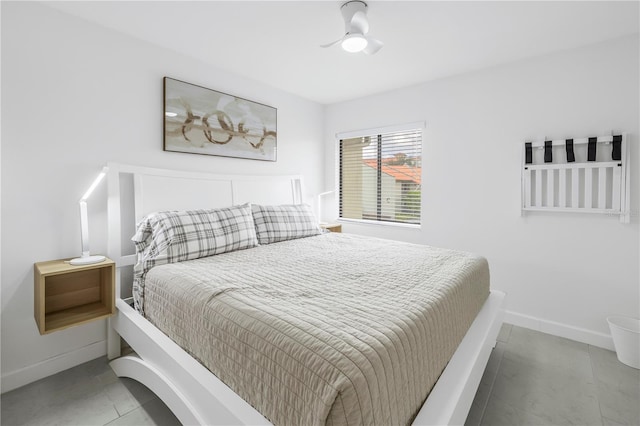 bedroom featuring ceiling fan and light tile floors